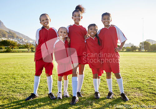 Image of Sports, football and team portrait of children, friends group or athlete players happy before game. Teamwork, girls partnership and collaboration of youth kids on soccer field for training exercise