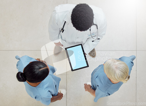 Image of Topview of doctors, tablet green screen and nurses mockup of hospital for patient healthcare with professional consultation. Digital health report, medical diagnosis and consulting colleagues at work