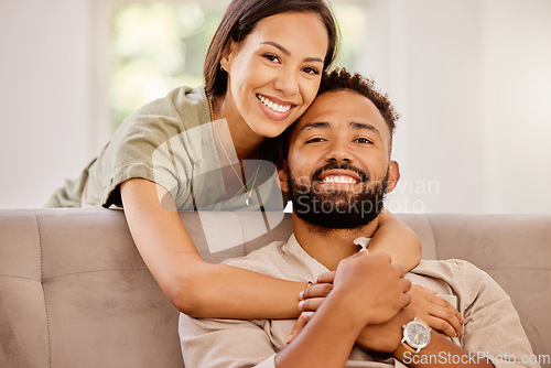 Image of Relax, love and portrait of couple on sofa together for happy, marriage and affectionate hug. Smile, connection and care with man and woman in living room together for relationship, peace or wellness