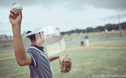 Image of Baseball, pitcher and athlete throwing a ball on an outdoor field during a game or training. Fitness, sports and softball player practicing his skill at match or exercise on outside pitch or stadium.
