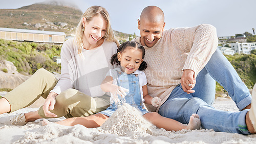 Image of Happy, beach and family with castle in sand for summer, freedom and travel vacation together. Love, smile and relax with mother and father playing with girl for holiday, lifestyle and building