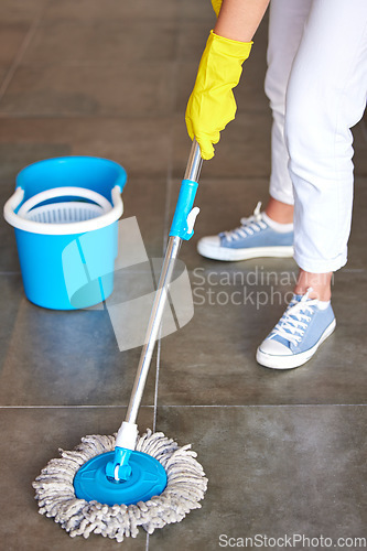 Image of Woman, mop or bucket in floor cleaning at home or office building by cleaner service, maid or housekeeping worker. Person mopping, healthcare maintenance or water container in bacteria safety control