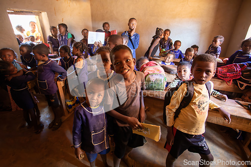 Image of Happy Malagasy school children students in classroom. School attendance is compulsory, but many children do not go to school.