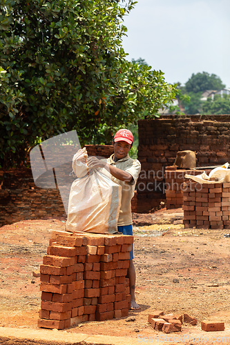 Image of Street vendor selling handmade building bricks. Mandoto, Madagascar