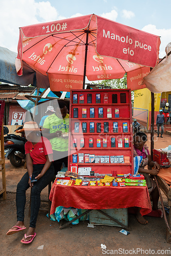 Image of Malagasy woman sell old fashioned cellular mobile phones on the street of Mandoto.