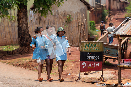 Image of The three Malagasy schoolgirls in blue uniforms, Mandoto Madagascar