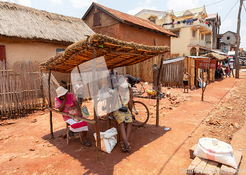 Image of Street market in Mandoto city, with vendors and ordinary people shopping and socializing. This image portrays the local lifestyle and economy of Madagascar.