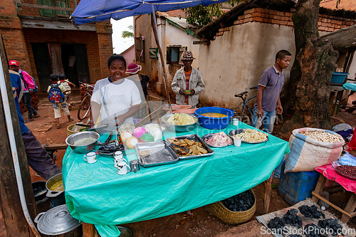 Image of Street market in Mandoto city, with vendors and ordinary people shopping and socializing. This image portrays the local lifestyle and economy of Madagascar.