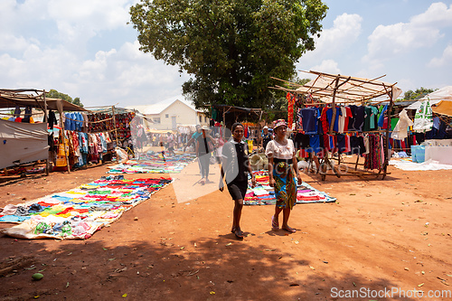 Image of Street market in Mandoto city, with vendors and ordinary people shopping and socializing. This image portrays the local lifestyle and economy of Madagascar.