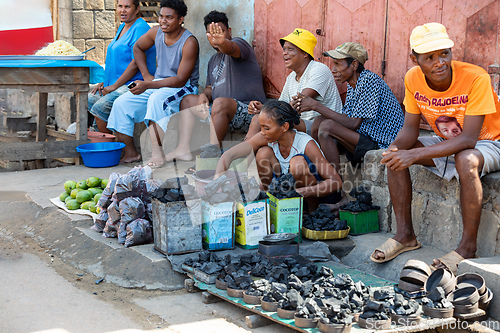 Image of Street market in Miandrivazo, woman selling charcoal. Madagascar