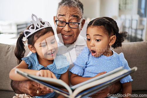 Image of Book, reading and grandfather with wow, children and learning story, language development and education on living room sofa. Family, Senior man teaching kids to red for kindergarten holiday fun