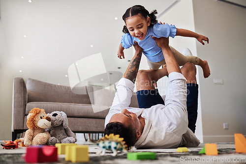 Image of Dad, lying and lifting with child, airplane or playing in living room for care, bonding and happy. Father, girl and floor with toys, game or plane with legs in house, lounge or apartment with love