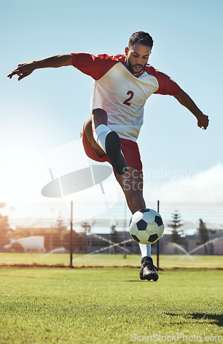 Image of Man, soccer and ball tricks in sports, fitness and exercise for training, workout or practice on the field in the outdoors. Athletic active soccer player in football sport trick, motivation or cardio