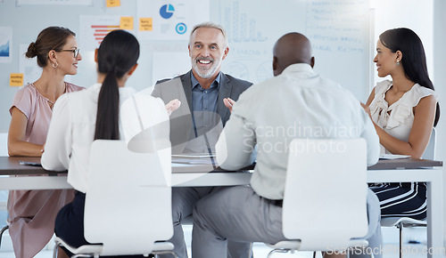 Image of Financial meeting, business people and happy leader in a business meeting with team in office, smile and innovation. Planning, budget and strategy with mature boss sharing goal, vision and mission