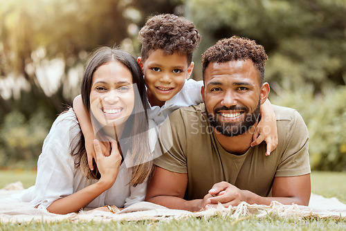 Image of Relax, picnic and happy with portrait of family in park for nature, smile and summer together. Spring, growth and wellness with mother and father hug with child in grass field for peace and health