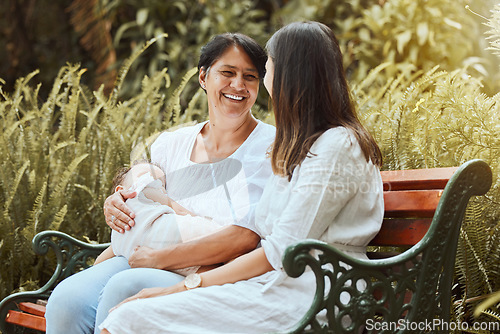 Image of Family, women and sleeping baby at a park in summer, relax and conversation in nature. Happy family, mother and and elderly woman relaxing on a park bench, laughing and enjoying rest, talking and joy