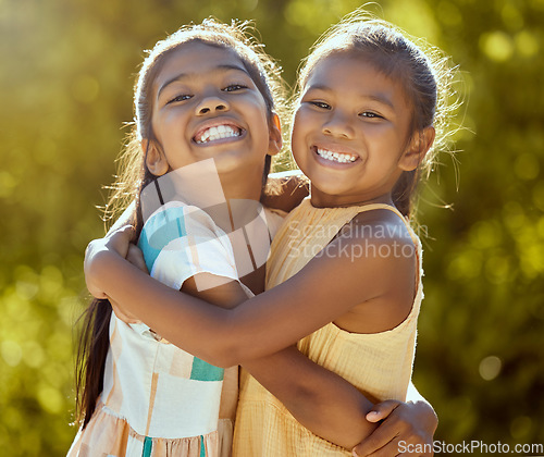 Image of Happy children, sisters and girl friends hug for love, care and bond in sun park, summer garden and backyard in outdoor Colombia. Big smile, funny and playful portrait of young kids hugging together