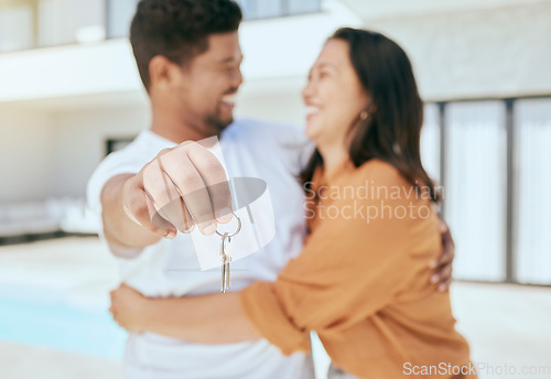 Image of Couple, hand and key to new real estate, property or house with mortgage loan approval, sales deal success or security investment. Zoom, smile or happy homeowner man and woman in hug and love bond