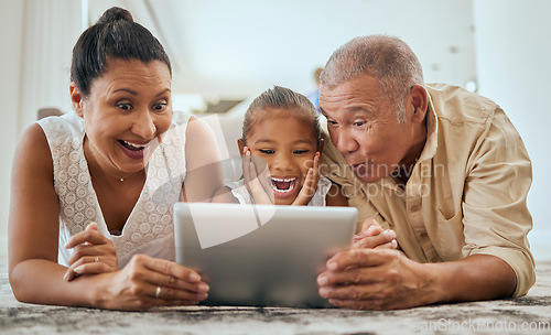 Image of Relax, digital tablet and family on floor in living room, wow and happy with online cartoon or animation in Mexico. Happy family, grandparents and girl bond, watch and enjoy internet fun together