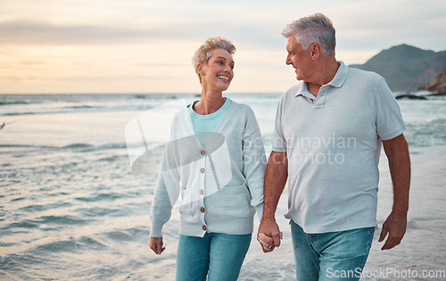 Image of Beach, holding hands and senior couple with sunset for outdoor wellness, retirement holiday and outdoor date mock up sky. Happy elderly people, or old man and old woman walking by sea or ocean water