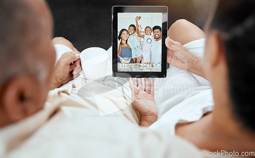 Image of Digital tablet, video call and family relax on sofa with grandparents talking to kids in kitchen, happy, smile and excited. Happy family, living room and online call with children and senior couple