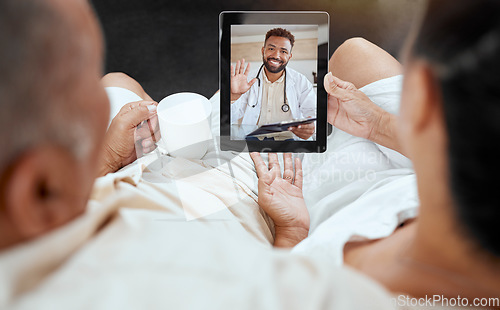 Image of Digital tablet, video call and doctor consulting with elderly couple in their home for telehealth, checkup and healthcare discussion. Living room, medical and health expert talking to senior people