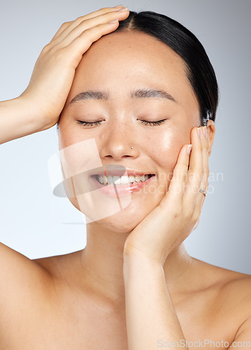 Image of Skincare, beauty and woman with a smile in a studio with cosmetic, face and dermatology treatment. Happiness, joy and girl model from Japan with healthy, wellness and clean skin with a facial routine