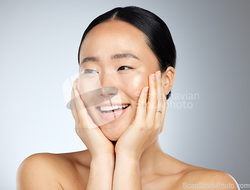 Image of Skincare, beauty and woman with smile for dermatology against a grey mockup studio background. Face of a happy, relax and Asian model excited about facial care, wellness of skin and cosmetics