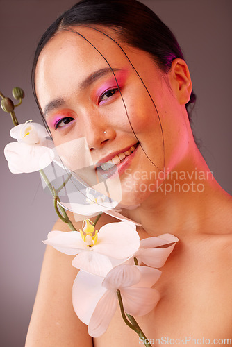 Image of Beauty, flowers and makeup, portrait of woman from Japan with eyeshadow and smile on face. Nature, luxury spa and natural skincare product ingredients for facial and makeover on beautiful asian girl.