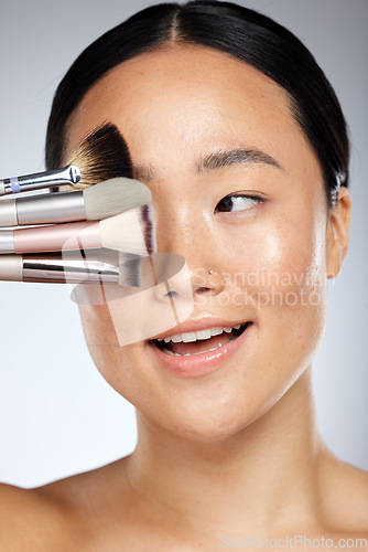 Image of Makeup, brush and beauty woman for asian skincare glow, cosmetics or product advertising with studio mock up. Dermatology, skin care and artist or Japanese model cover eye for marketing mockup