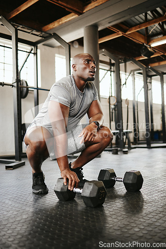 Image of Weights, fitness and black man training in the gym for motivation, body health and sport goal. Tired African athlete and bodybuilder thinking before workout, exercise and cardio for strong arm muscle