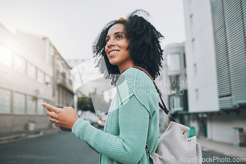 Image of Happy, black woman and phone for travel in the city of a tourist enjoying sightseeing in an urban street. African American female traveler in communication or navigation on smartphone in South Africa