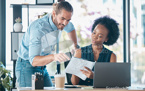 Image of Documents, teamwork and laptop with a business man and black woman at work together in the office. Meeting, accounting and finance with a male and female employee team working in collaboration