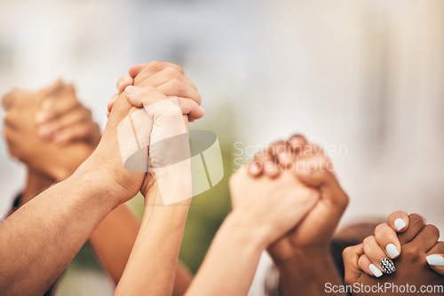 Image of Diversity, community collaboration and holding hands in air strong together or racial empowerment march. Peace protest, trust teamwork and friendship help or friends, group or support human rights