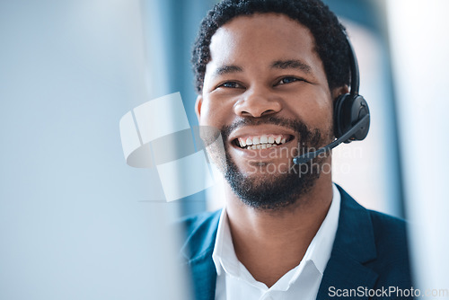 Image of Customer support, black man and call center consultant speaking to an online client with a headset. Customer service, receptionist and telemarketing sales man consulting with technology in the office