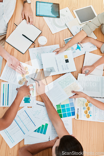 Image of Finance, documents and meeting with a business team at a table in an office boardroom for planning from above. Accounting, growth and investment with a financial group working together in the office