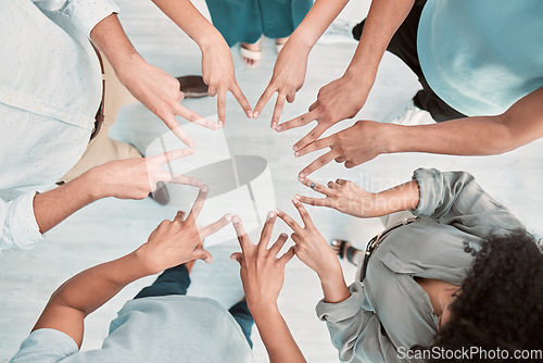 Image of Business people, hands and peace in support above for trust, unity or teamwork for company goals at the office. Hand of group in corporate solidarity, partnership and star symbol with fingers at work