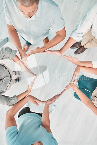 Image of Support, group and heart hand with top view for company solidarity, synergy or team building. Trust, unity and care of office people with hands together for integrity, cooperation or kindness.