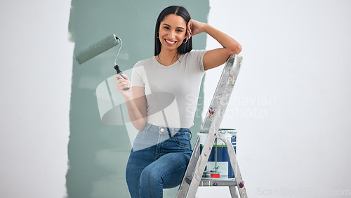 Image of Paint, wall and woman with color choice in portrait for home renovation, room interior or creative hardware project inspiration. Happy woman painter on ladder for painting with mock up marketing