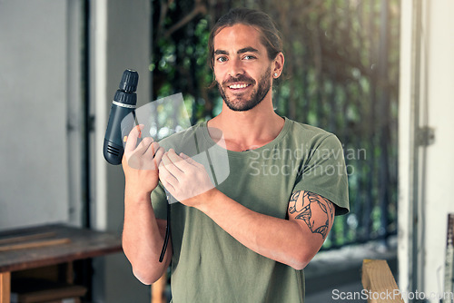 Image of DIY, drill and home improvement with a man handyman working alone in a home for renovation or improvement. Construction, portrait and maintenance with a male contractor at work with a power tool