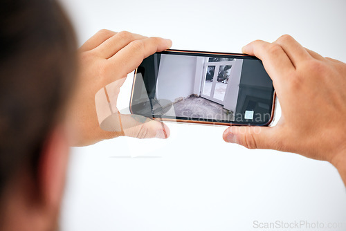 Image of Surveillance, cctv and smartphone screen in hands for door monitor on wall mock up for trust, safety and home insurance security. Man on cellphone technology app online, live streaming camera system