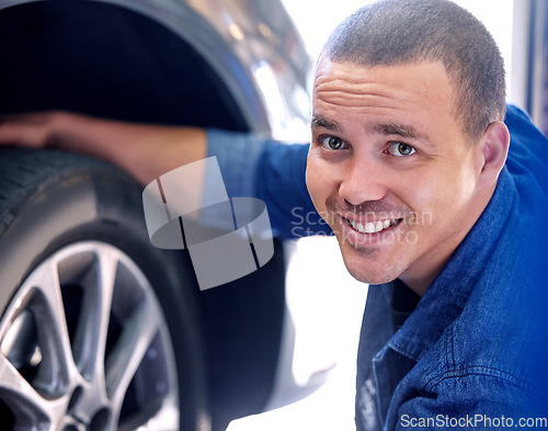 Image of Mechanic, tire change and happy man car service assistant in automobile shop or road side assistance. Wheel safety, break pad inspection and professional automobile maintenance worker in motor garage