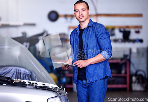 Image of Car, clipboard and portrait of a mechanic at his workshop doing a motor inspection with a checklist. Engineering, industrial and man working on vehicle for engine maintenance, repair or fix in garage
