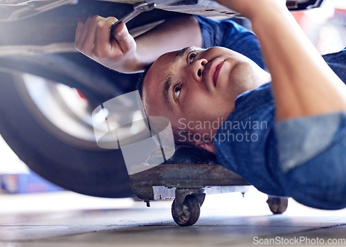 Image of Mechanic, wrench or fixing car in mechanical engineering workshop, vehicle manufacturing industry or garage store. Thinking man, auto motor worker and service employee in transport repair maintenance