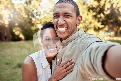 Image of Selfie, love and garden with a black couple taking a photograph while standing outdoor together in the yard. Portrait, smile and happy with a man and woman posing for a picture on a summer day