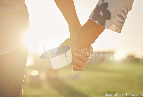 Image of Retirement, couple and hands with sun closeup of married man and woman on field for summer walk. Support, care and trust of senior people in marriage walking in sunlight for romantic evening.