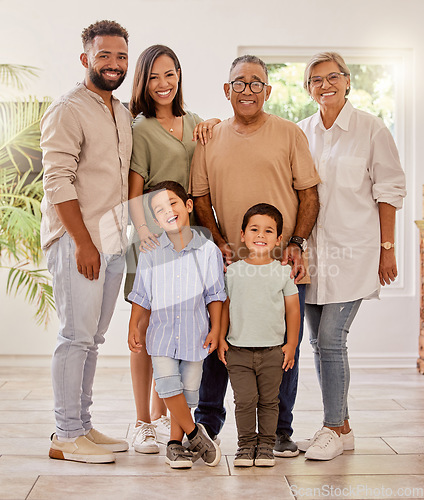 Image of Happy family portrait with kids, parents and grandparents with smile standing in brazil home. Happiness, family and generations of men, women and children spending time together making fun memories.