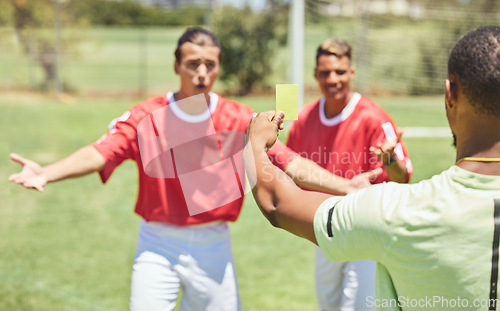 Image of Man, soccer player and yellow card from referee for sports foul, misconduct or unfair play on the field. Confused men in soccer match getting a warning, sign or penalty for fail in football game law