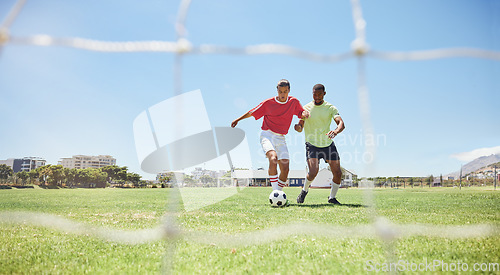 Image of Soccer, sports and competition with a man athlete and opponent playing a game on a grass pitch. Football, fitness and exercise with a male soccer player and rival running on a field for a workout