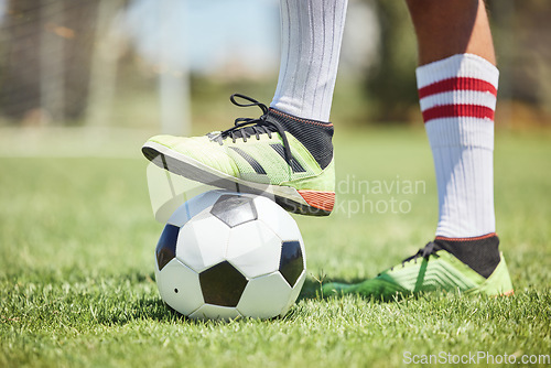 Image of Soccer ball, soccer player shoes and foot on field to kick off, competition games and sports training on stadium grass pitch. Football player feet, man athlete action and power to score goals on turf